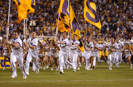 LSU Cheerleaders run onto the field 